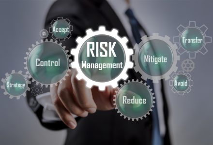 Businessman pointing at risk management concept on screen